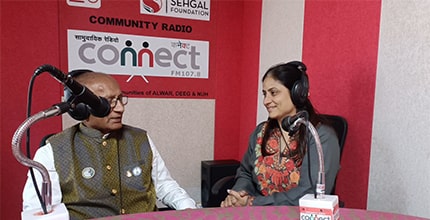 Mr. Ram Gada at the community radio Connect station with Pooja O. Murada